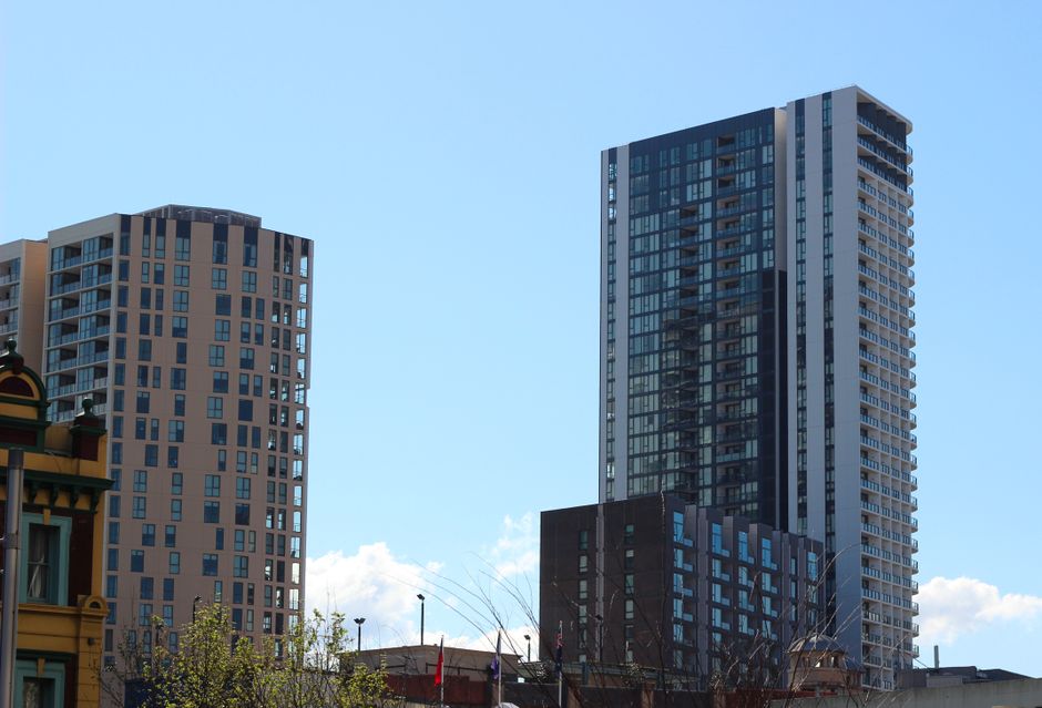 High-rise buildings in Sydney, Australia under a clear, blue sky. Modern urban skyline.